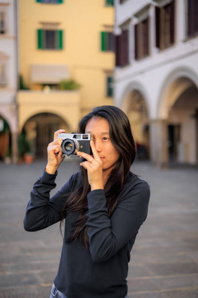 istock Photographer shooting analog film camera 2184643171