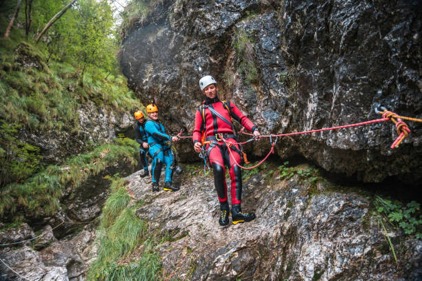 istock Diverse Friends Climbing in Canyoning Adventure 2184648195