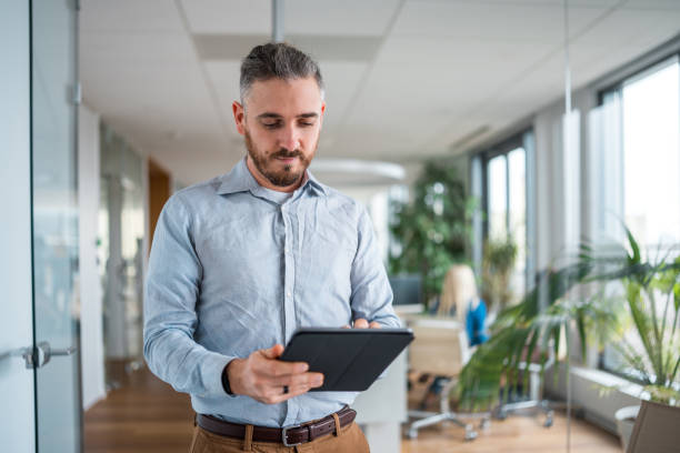 istock Mid Adult Caucasian Man Coping with Wireless Technology 2184648685