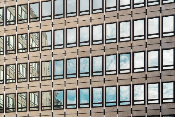 sunset reflection in the windows of the building. part of the building