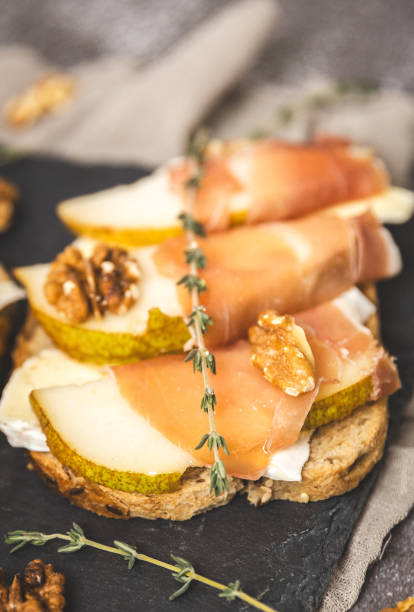 istock A tray with one delicious sandwiches on the table. 2184651047