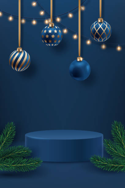 istock Blue and gold Christmas ornaments hanging with string lights, on a navy background with pine branches and podium 2184658291