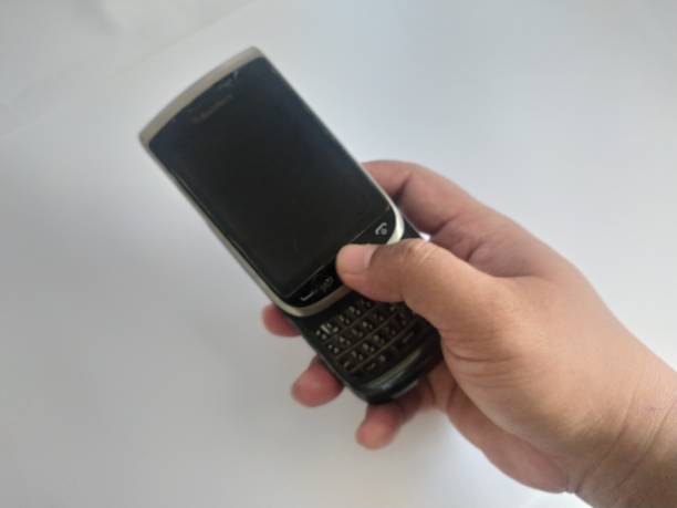 istock Old black cell phone, keyboard slide on white background 2184663226