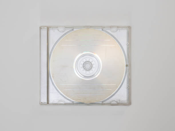 Empty CD in a Transparent Jewel Case Empty CD in a transparent jewel case on a white background. Compact disc in a scratched and used plastic box. Blank template for a music EP or LP mockup. clear cd case stock pictures, royalty-free photos & images