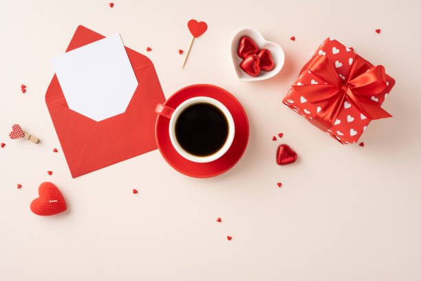 istock A cozy valentine's day setup featuring coffee, an envelope, a gift, and heart shaped candies, creating a romantic and warm atmosphere 2184681103