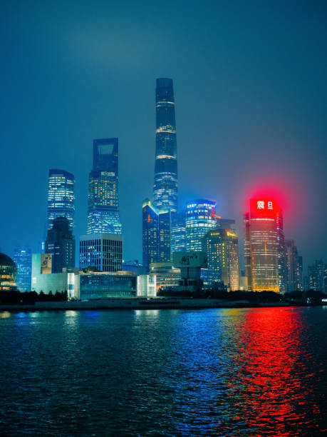 Neon-lit The Bund, Shanghai cityscape at night in China