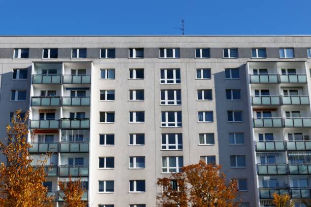 istock Apartment building with balconies and autumn trees. 2184684505