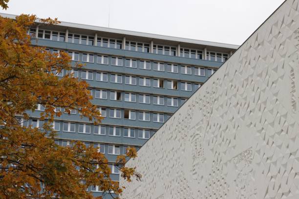 istock Modern architecture with geometric facade and autumn leaves. 2184684634
