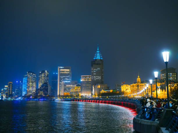 Neon-lit The Bund, Shanghai cityscape at night in China