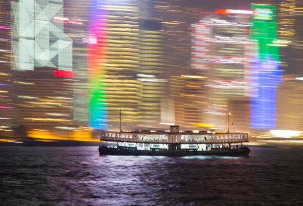 China Hong kong Star ferry crossing harbour at night