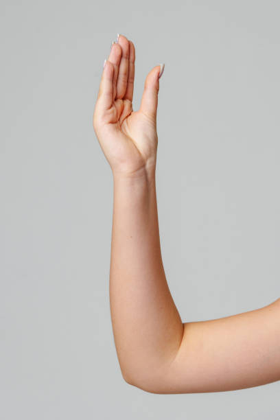 istock Raised hand against a neutral background in a softly lit setting 2184688642
