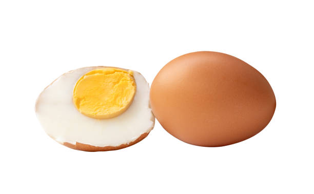istock Side view of boiled or cooked brown chicken eggs with half and egg yolk in stack isolated on white background with clipping path 2184689441