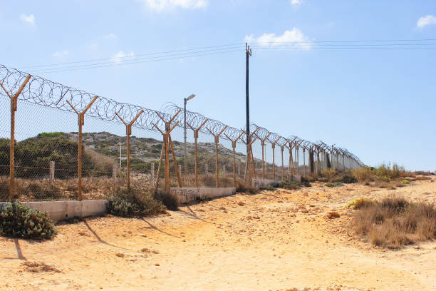 istock Protected area on Capo Greco in Cyprus. Barbed wire in deserted area. 2184690905