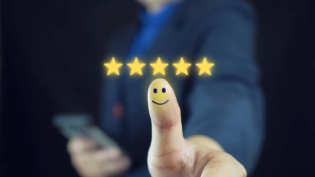 istock Customer satisfaction concept. Hand with thumb up Positive emotion smiley face icon and five star with copy space. 2184694491
