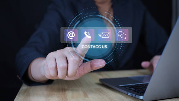 istock Contact us or Customer support hotline people connect. Businessman use computer keyboard and virtual screen contact icons ( email, live chat, internet wifi ).Contact us connection concept . 2184694535