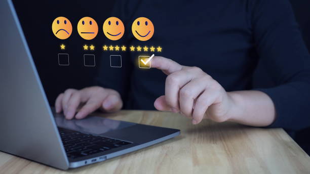 istock Customer services best excellent business rating experience. Satisfaction survey concept. Business people are touching the virtual screen on the happy Smiley face icon to give satisfaction in service. 2184694546