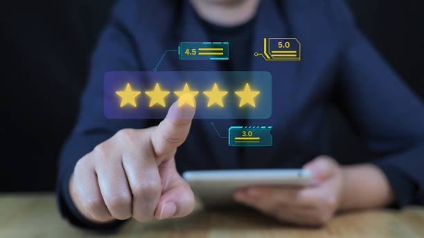 istock Businessman using tablet with popup five-star icon for feedback review satisfaction service, Customer service experience and business satisfaction survey. Good product and service, best quality 2184694560