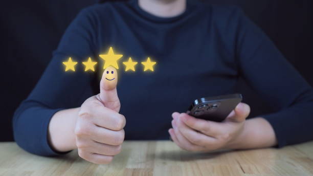 istock Customer satisfaction concept. Hand with thumb up Positive emotion smiley face icon and five star with copy space. 2184694569