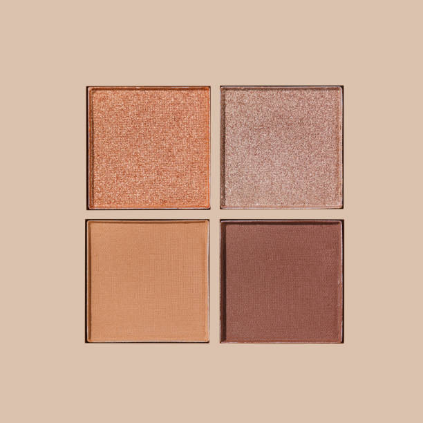 istock Neutral Eyeshadow Palette with Matte and Shimmer texture, natural colored shades on beige. Set of eyeshadow refills, Top view of four Swatches Eyeshadow makeup for cosmetic, makeup, beauty concept 2184694653