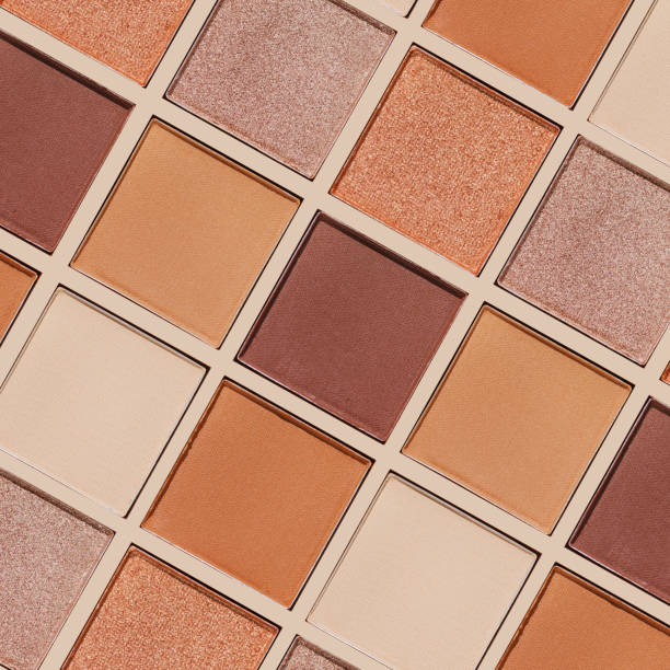 istock Swatches eyeshadow refills as minimal graphic pattern. Matte and glitter pans beige brown copper shade, detailed texture, sun light, minimal trend cosmetics background, beauty product, eye makeup 2184694657