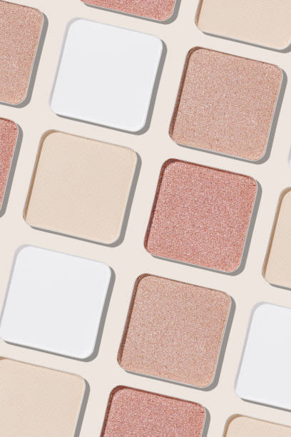 istock Swatches eyeshadow refills as minimal monochrome pattern. Matte and glitter pans white beige pink shades, detailed texture, sun light, stylish cosmetics background, beauty product, eye makeup 2184694658