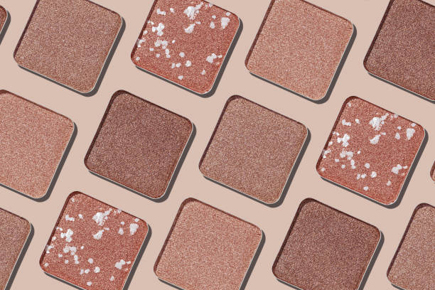 istock Cosmetics texture pattern, makeup palette vivid neutral color eye shadow, square eye powder swatches. Female cosmetic and beauty products, aesthetic minimal beauty photo, shimmer eyeshade, top view 2184694663