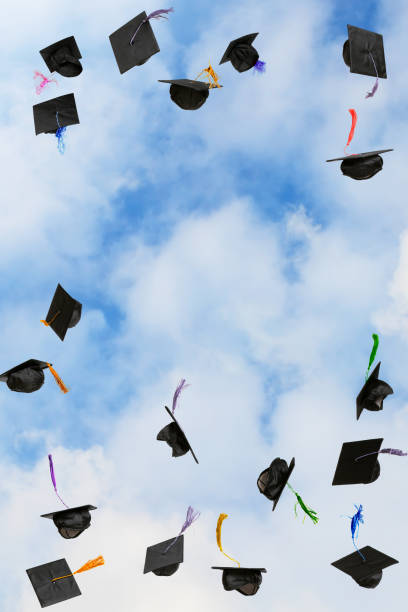 istock Graduation caps thrown in the sky 2184695747