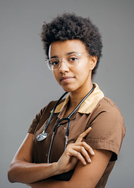 istock Confident Young Nurse in Vintage Uniform Posing with Stethoscope 2184697471