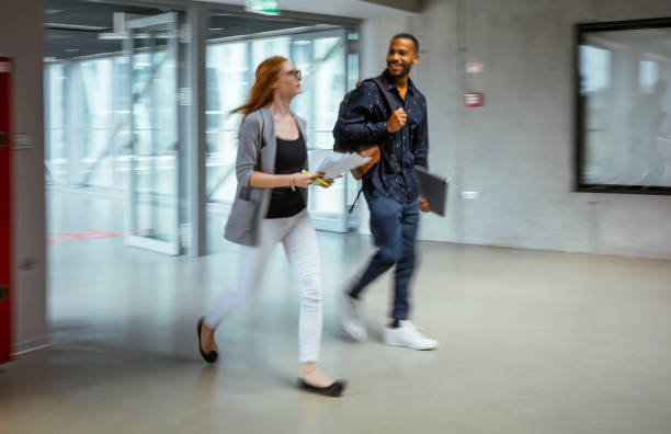 istock Energetic Business Professionals in Swift Office Movement 2184697738