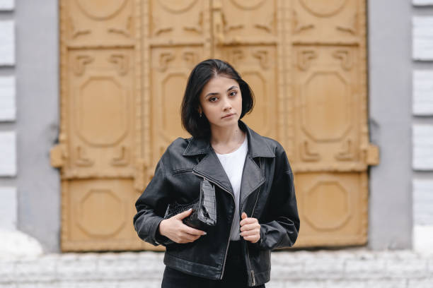 istock young woman at street 2184698787
