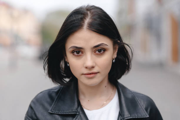 istock young woman at street 2184698795
