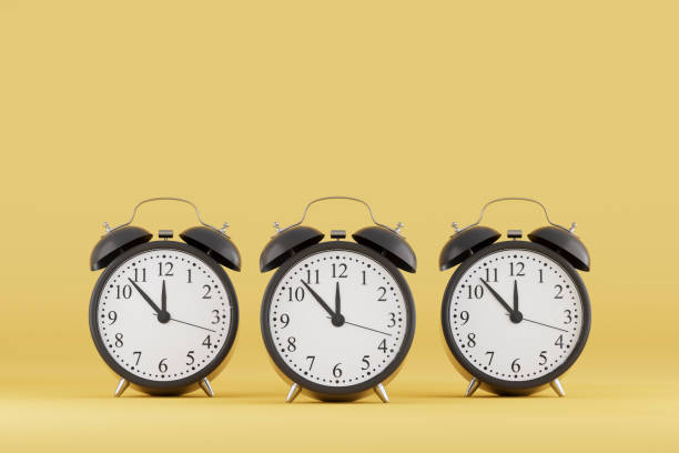 istock Black Friday Concept, Black Alarm Clocks on Yellow Background 2184699054