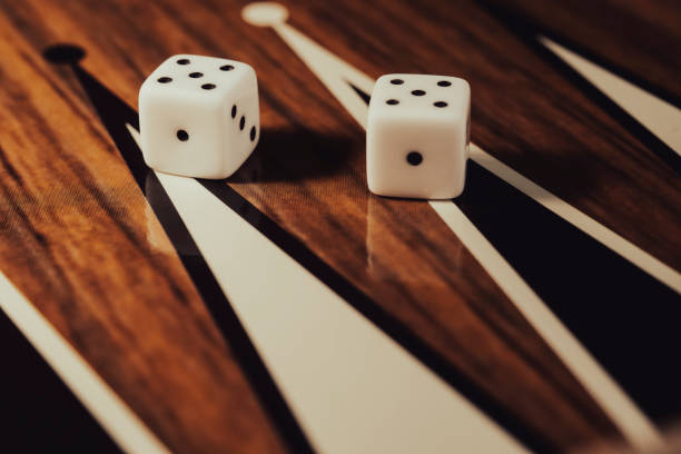 istock Backgammon game with dices on wooden board 2184700153