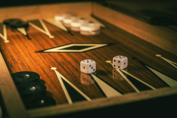 istock Backgammon game with dices on wooden board 2184700167