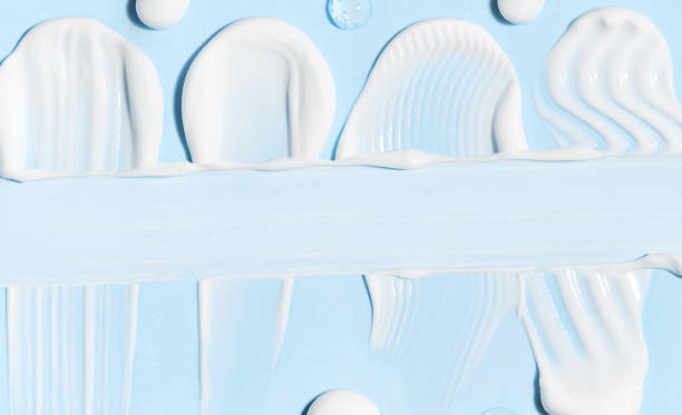 istock creamy texture of cosmetic samples on blue background 2184700179