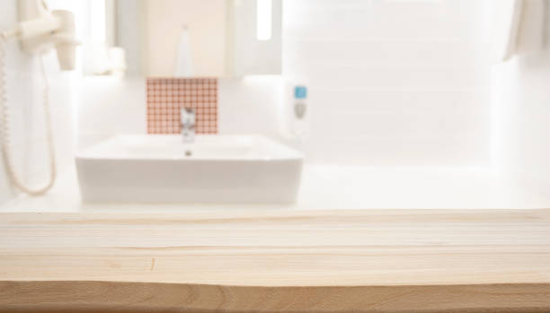 istock Empty wooden top table with blurred bathroom interior background for product display 2184700396