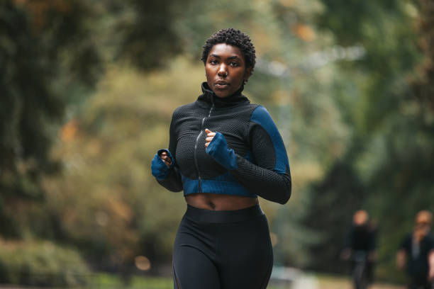 istock Young woman running in Central Park 2184701551