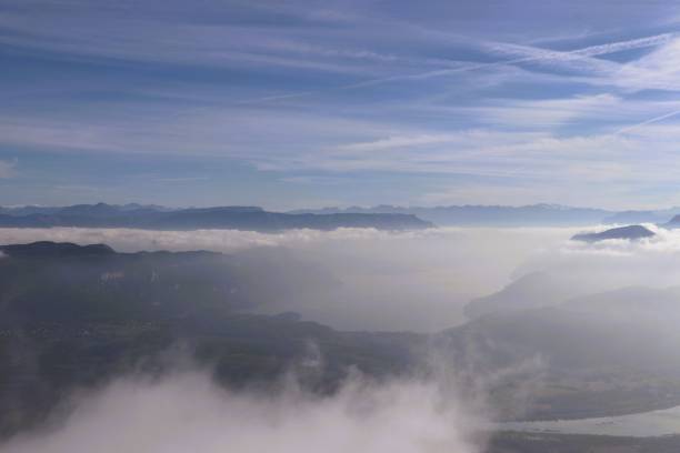 istock Serene mountain landscape with misty clouds and blue sky. 2184701788