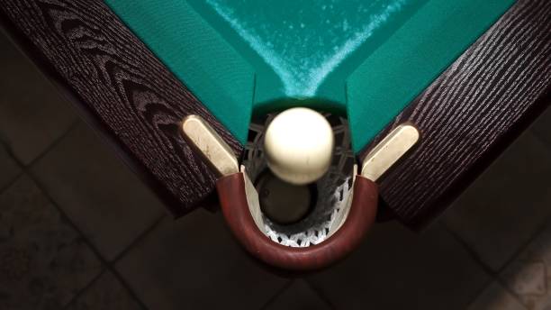 Couple playing snooker in a bar