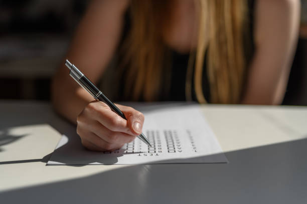 istock A school girl is solving a multiple choice test, school and education 2184703783