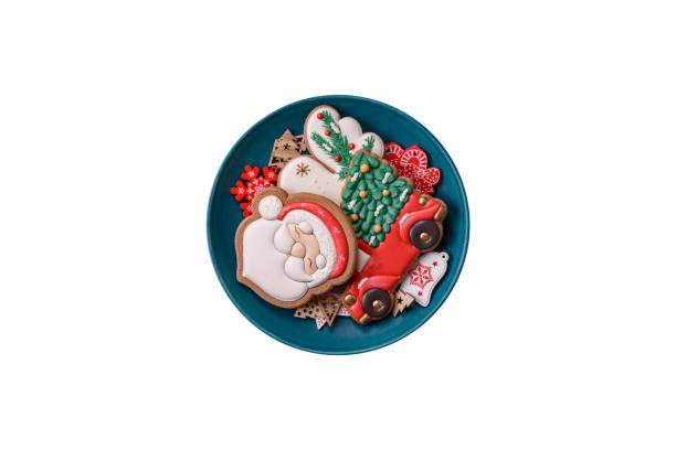 Homemade Christmas gingerbread cookies made as sweets and holiday table decorations