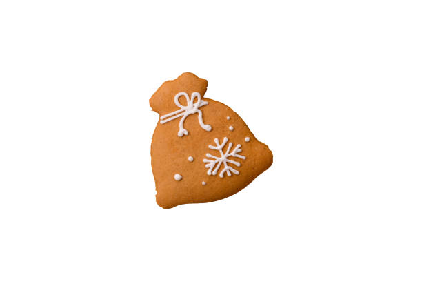 Homemade Christmas gingerbread cookies made as sweets and holiday table decorations