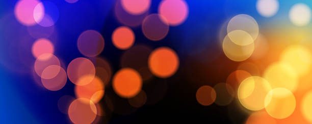 istock Abstract festive blurred background. Vibrant bokeh lights. Bright defocused glowing lights effect. Graphic template for celebration banners and invitations. 2184705557