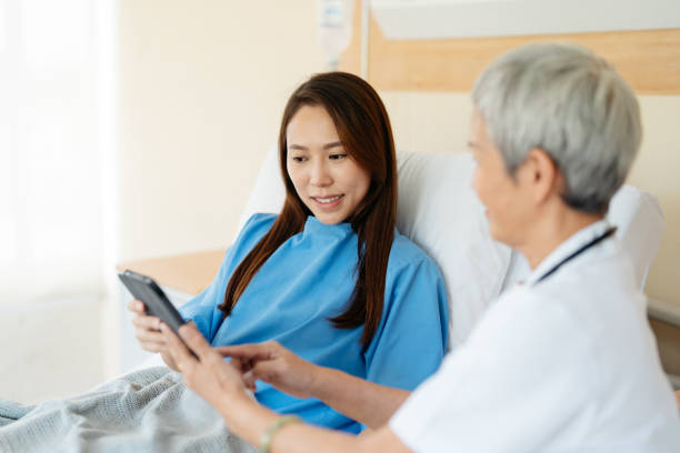 istock Doctor visit patient in hospital ward 2184705834