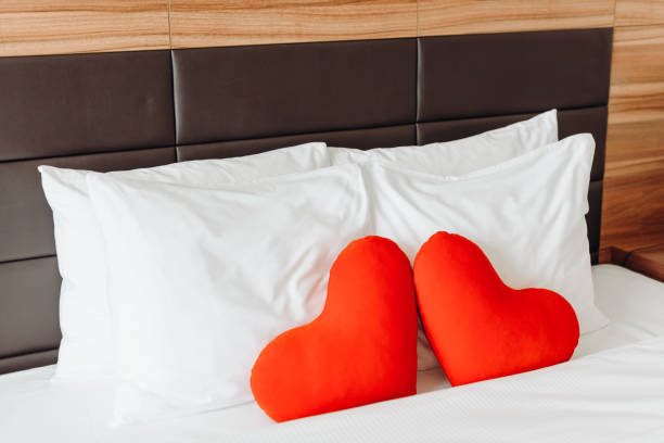 istock red stuffed toys in heart shape on bed 2184706182