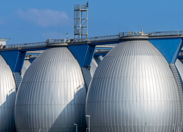 Germany, Hamburg, Harbor, August 18, 2023 -Sewage sludge silos against the sky