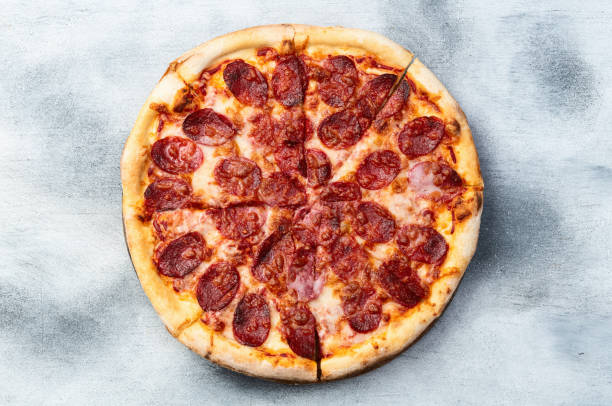 istock Pizza pepperoni fast food . Top view on rustic background 2184711807