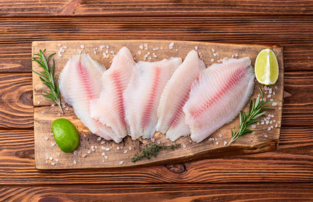 istock Raw tilapia fillet photography . Top view 2184711849