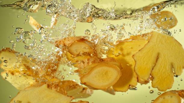 istock Freeze Motion of Ginger Slices Falling into Water. 2184713091