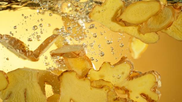 istock Freeze Motion of Ginger Slices Falling into Water. 2184713107